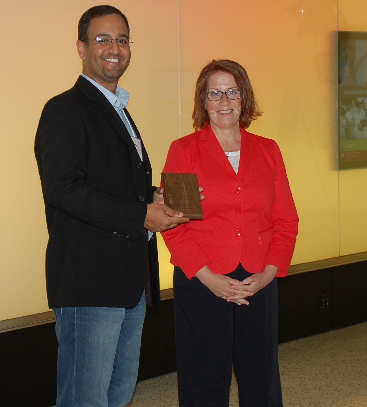 Dr. Zeeshan Syedain, seen here with Rep. Erin Murphy, received a Biobusiness/Biotechnology grant to develop a way to culture living, growing arterial grafts for children who currently require multiple open-heart surgeries when they outgrow their artificial grafts.